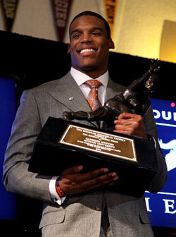 Cam Newton with Heisman Trophy